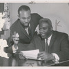 Jackie Robinson (right), and William B. Branch, director of Robinson's NBC radio program "The Jackie Robinson Show" 
