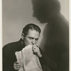 Alexander Kirkland (with newspaper) in the stage production Case of Clyde Griffiths