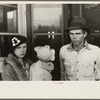 Scene in Smithland, Kentucky, man, woman, and child