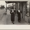 Two women walking along street, Natchez, Mississippi