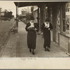 Two women walking along street, Natchez, Mississippi