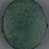 Leather locket containing the portrait photograph and lock of hair.