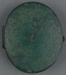 Leather locket containing the portrait photograph and lock of hair.