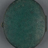 Leather locket containing the portrait photograph and lock of hair.