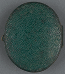 Leather locket containing the portrait photograph and lock of hair.