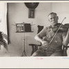 One of the Westmoreland homesteaders playing his violin, Pennsylvania