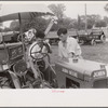 Examining tractor on display at county fair, central Ohio