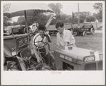 Examining tractor on display at county fair, central Ohio