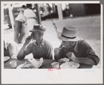 Spectators at county fair eating lunch, central Ohio