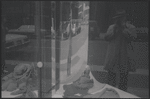 Shop window with reflected self-portrait. New York, NY