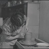 Woman making pottery
