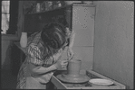 Woman making pottery