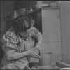 Woman making pottery