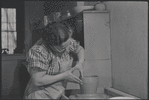 Woman making pottery