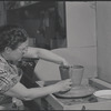 Woman making pottery