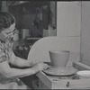Woman making pottery