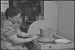 Woman making pottery