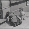 Boy and girl playing on sidewalk