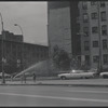Street scene with open fire hydrant. New York, NY