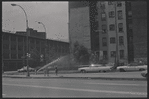 Street scene with open fire hydrant. New York, NY