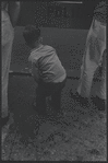 Boy facing away from camera. New York, NY