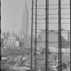 Construction work with Empire State Building in the background. New York, NY