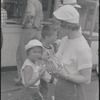 Mother and daughter eating hot dogs [Provincetown, MA?]