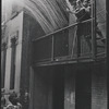 Boys playing on fire escape. New York, NY