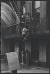 Boys playing on fire escape. New York, NY