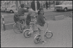 Boys riding bicycles [Knokke, Belgium?]