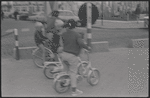 Boys riding bicycles [Knokke, Belgium?]