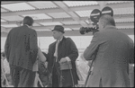Cameraman filming on ferry. New York, NY