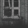 Children in the windows of an abandoned building