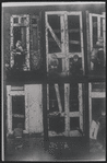 Children in the windows of an abandoned building
