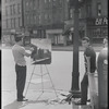 Artist painting on street corner. New York, NY