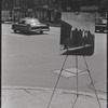 Artist painting on street corner. New York, NY