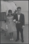 Girl and boy in dress clothes. New York, NY