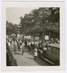 Marchers in street during Scottsboro protest parade in Harlem, New York