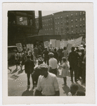 Scottsboro protest marchers, including picketers bearing signs supporting striking coal miners and social equality for blacks, in Harlem, New York