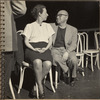 Robert Lewis and Agnes De Mille seated side by side looking at each other