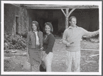 Group (3) outside dilapidated house during performance of The Gift