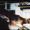 New York City theatre marquee at night (John Wayne movie The Horse Soldiers visible)