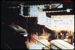 New York City theatre marquee at night (John Wayne movie The Horse Soldiers visible)