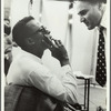 Miles Davis and George Avakian in recording studio, with John Coltrane in background