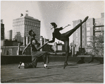 Dancer John Jones (left) with unidentified female dancer, performing on rooftop, when he was a member of choreographer Antony Tudor's dance class at the Ballet Guild, Philadelphia, ca. 1954
