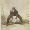 Unidentified baseball player in dark uniform - catching form