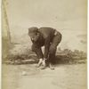 Unidentified baseball player in dark uniform - catching form - bent