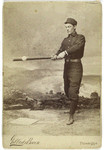 Unidentified baseball player in dark uniform - batting form