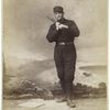 Unidentified baseball player in dark uniform - batting form - bat on shoulder