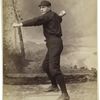 Unidentified baseball player in dark uniform - pitching form